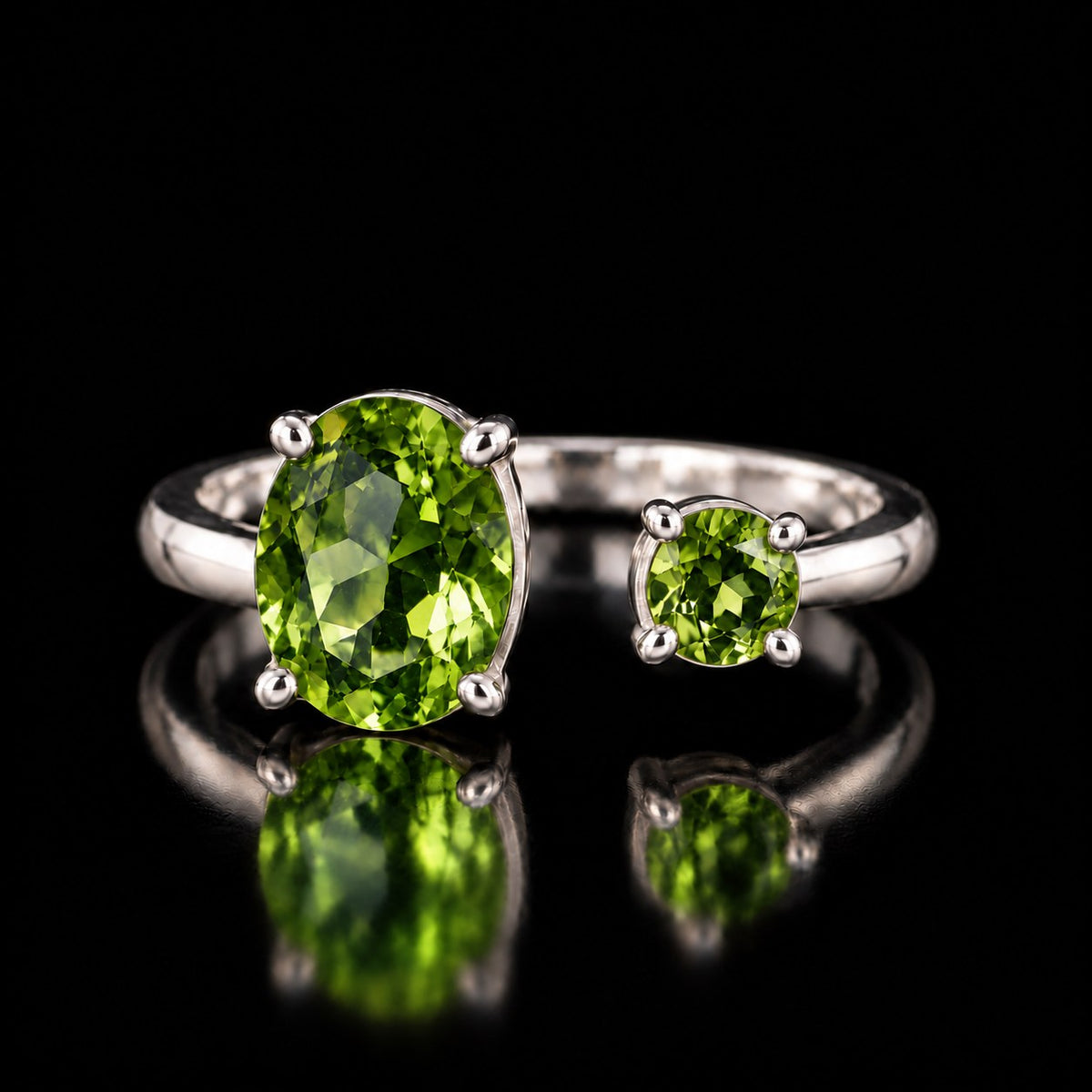VooDooStone open gap ring in sterling silver, stones peridot green under fluorescent light, front view