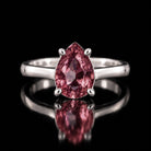 Sterling silver VooDooStone pear-cut solitaire ring, stone purplish-pink in daylight, shown front-on. Item 894782.