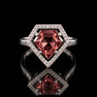 Sterling silver VooDooStone shield-cut halo ring, center stone purplish-pink in daylight inside a white pave halo, front view. Item 894784.